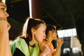 A side photo of three teammates, restless and focused, holding their fists for their team& x27;s victory. Strength and