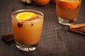 Side point of view Mulled Wassail Cider with cinnamon sticks and orange slice Royalty Free Stock Photo