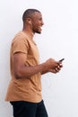 Portrait of afro american man listening music against white background Royalty Free Stock Photo