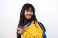 Happy Indian female student with bag and mobile phone on isolated white background Royalty Free Stock Photo