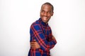 Side of happy young black guy smiling against white wall Royalty Free Stock Photo