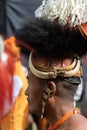 A side Portrait of a Naga tribesman dressed in traditional headgear