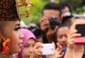 Side portrait of traditional Minang dancer looking at crowd