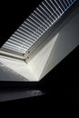 A side portrait of a velux roof window with a closed jalousie in it to keep the sun and warmth out or to keep the light from