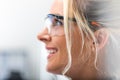 Side portrait of young attractive woman in protective eyeglasses Royalty Free Stock Photo