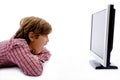 Side pose of boy watching lcd screen Royalty Free Stock Photo