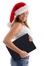 Side pose of woman with christmas hat and laptop Royalty Free Stock Photo