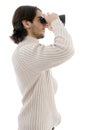 Side pose of young male watching through binocular Royalty Free Stock Photo