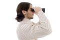Side pose of young man watching through binocular Royalty Free Stock Photo