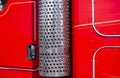 Red big rig semi trucks cab wall and stainless trucks exhaust pipe filter Royalty Free Stock Photo