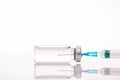 Side profile close up cropped view photo of syringe and glass container with transparent liquid inside isolated white background Royalty Free Stock Photo