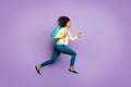 Side profile full length body size photo of cheerful positive running jumping girl wearing pants trousers yellow shirt Royalty Free Stock Photo