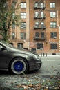 Side profile of German lowered car with blue shiny wheels