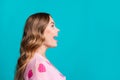 Side profile photo of amazed brown hair curls model woman in pink jumper open mouth amazed look novelty isolated on blue Royalty Free Stock Photo