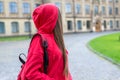 Side profile photo of sad unhappy sad regretful teen teenager hipster person looking back at university building Royalty Free Stock Photo