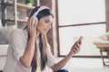 Side profile proto of beautiful lady, listening to music in big Royalty Free Stock Photo
