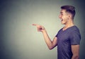 Surprised young man pointing finger Royalty Free Stock Photo