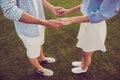 Side profile view of carefree guy`s arms in checkered shirt, bonding dreamy lady. Leisure, chill, lawn stroll, relax lifestyle, w Royalty Free Stock Photo