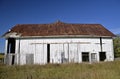 Side profile of a white abandoned barn Royalty Free Stock Photo