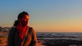 Side profile of a woman wearing a face mask at the Sea Point Promenade