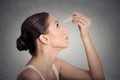 Side profile young woman applying eye drops Royalty Free Stock Photo