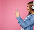 Side-ptofile closeup photo of beautiful smiling happy young woman wearing stylish casual outfit isolated over colorful Royalty Free Stock Photo