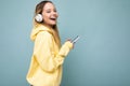 Side-ptofile photo of beautiful laughing happy young woman wearing stylish casual outfit isolated over colorful Royalty Free Stock Photo