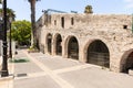 Side quiet street with stone pavement and with white painted houses in Zikhron Yaakov city in northern Israel