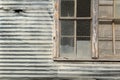 Side of Quonset Hut building with partial window frame