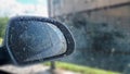 side rear-view mirror on a modern car. Water drop nature fresh wet background Royalty Free Stock Photo