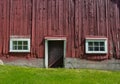 Side of red barn with windows Royalty Free Stock Photo