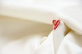 Side red haert shape with buttonhole stitch and white febric background Royalty Free Stock Photo