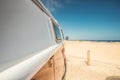 Side of a red vintage van parked on the beach in Fuerteventura Royalty Free Stock Photo