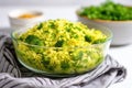 side shot of broccoli rice in a clear glass bowl