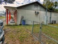 Side of strip center retail building chain link Tampa Florida