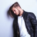 Side of a thoughtful young man in leather jacket Royalty Free Stock Photo