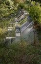 Side of Traditional chinese graves are at Chinese Cemetery in Bangkok city. A rows of gray stone tombstones is in the graveyard