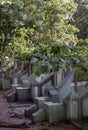 Side of Traditional chinese graves are at Chinese Cemetery in Bangkok city. A rows of gray stone tombstones is in the graveyard Royalty Free Stock Photo