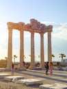 Side, Turkey - April 19 - 2019: Tourists take photos against the background of the ancient temple of Apollo Royalty Free Stock Photo