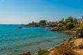 SIDE, TURKEY: View of the old Turkish houses on the street in the city of Side and the Mediterranean Sea. Royalty Free Stock Photo