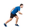 Side vie full length of determined caucasian man runner standing in running position looking ahead confident