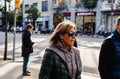 Side view of adult female tourist wearing sunglasses