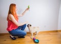 The hostess teaches pets to get along Royalty Free Stock Photo