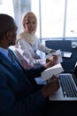 Business people interacting with each other at table in conference meeting Royalty Free Stock Photo