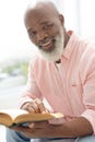 Smiling man reading a book Royalty Free Stock Photo