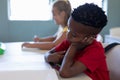 Schoolboy sitting at a desk in an elementary school classroom Royalty Free Stock Photo