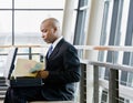 Side view of African businessman reviewing files