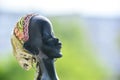 Side view of african woman head on blurred background Royalty Free Stock Photo
