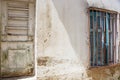 Side view of an alley with a door and a window