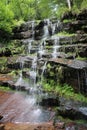 Side view of the amazing Tupavica waterfall and trees in background